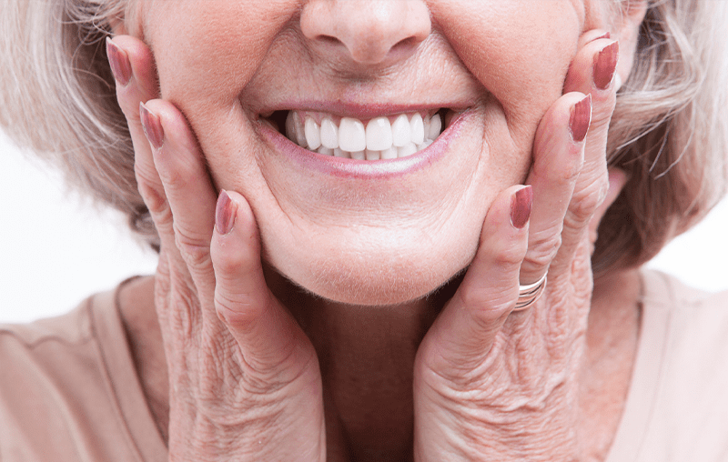 A close up of an older woman 's smile