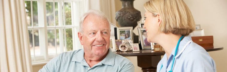 A man and woman sitting in front of each other.